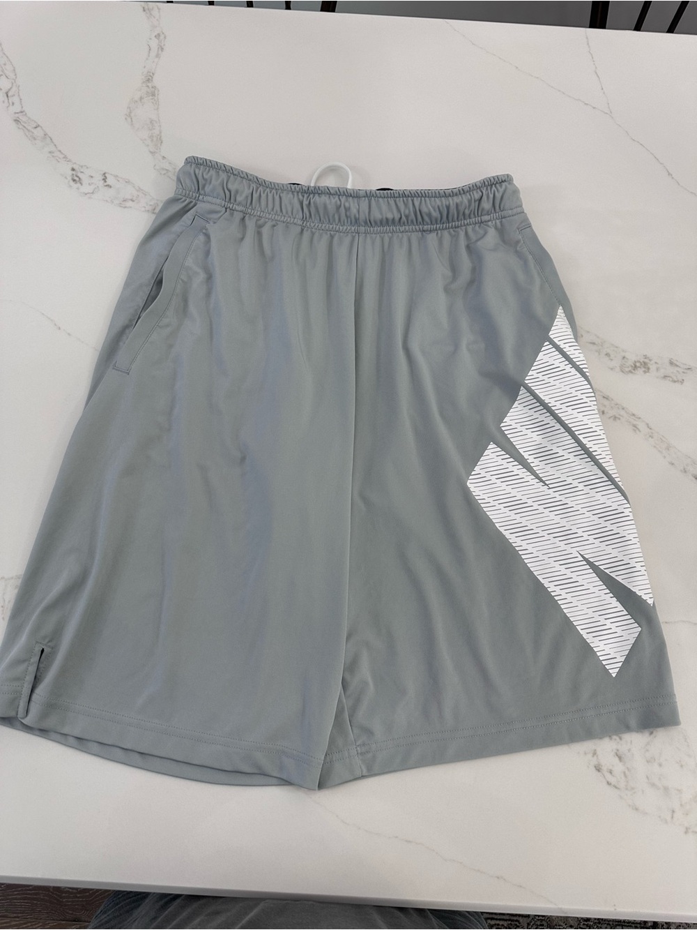 Nike Men's Light Gray Athletic Shorts with White Graphic
